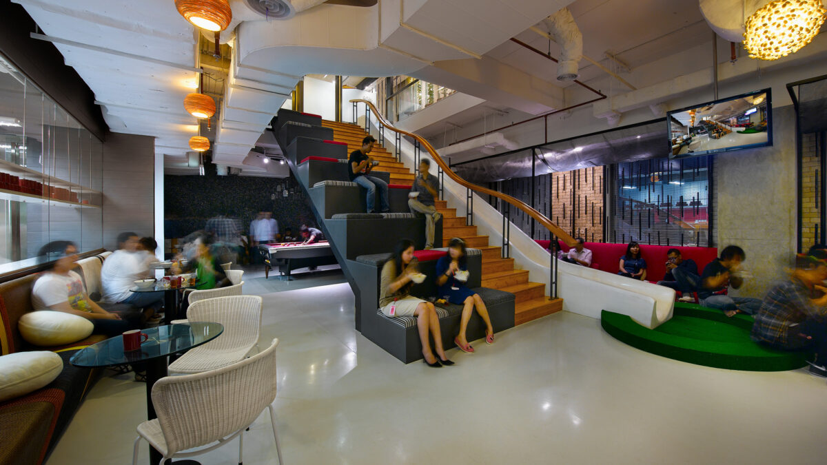 people sitting on slide in breakout area