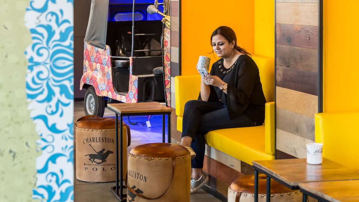 woman sitting on bench near rickshaw