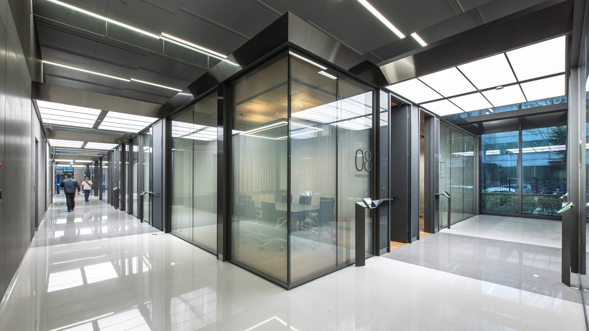 meeting room and someone walking down corridor
