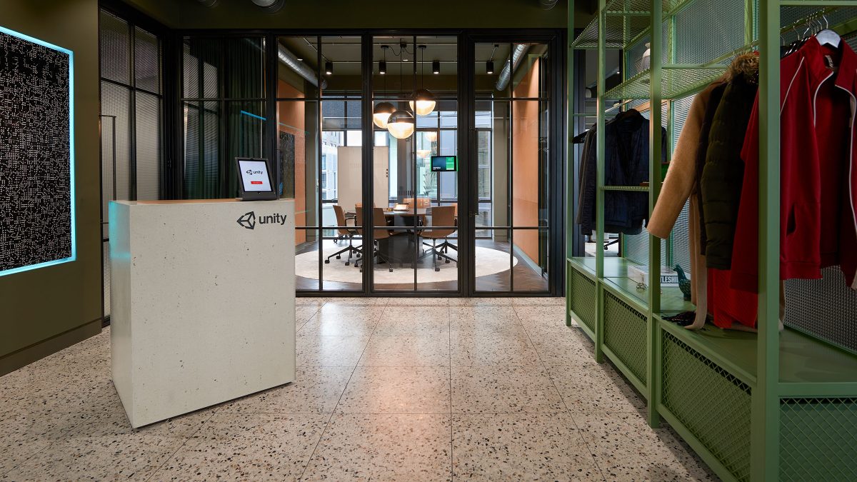tablet on reception desk and view of meeting room