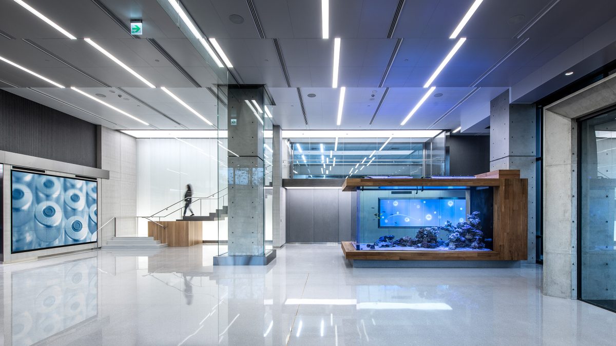 woman walking down staircase to lobby