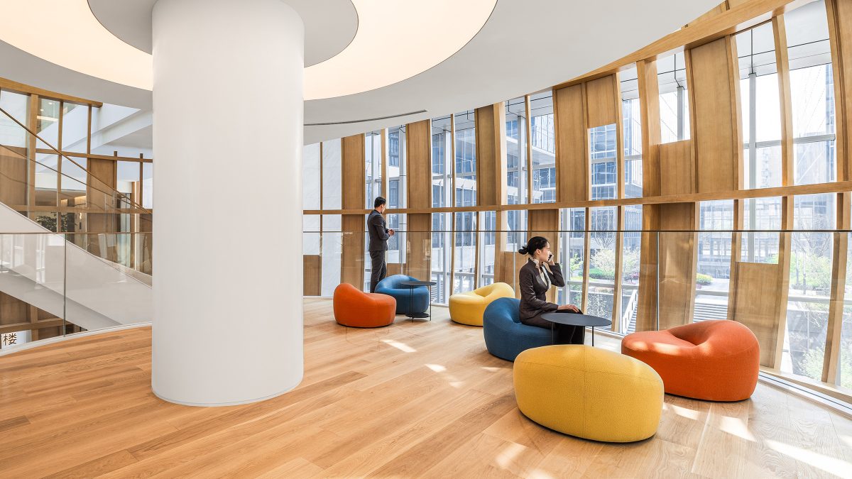 people sitting on soft seating having phone conversations