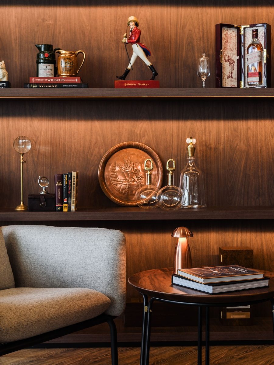 Brand accessories on shelves in lounge setting