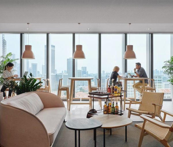 people working at high tables with view