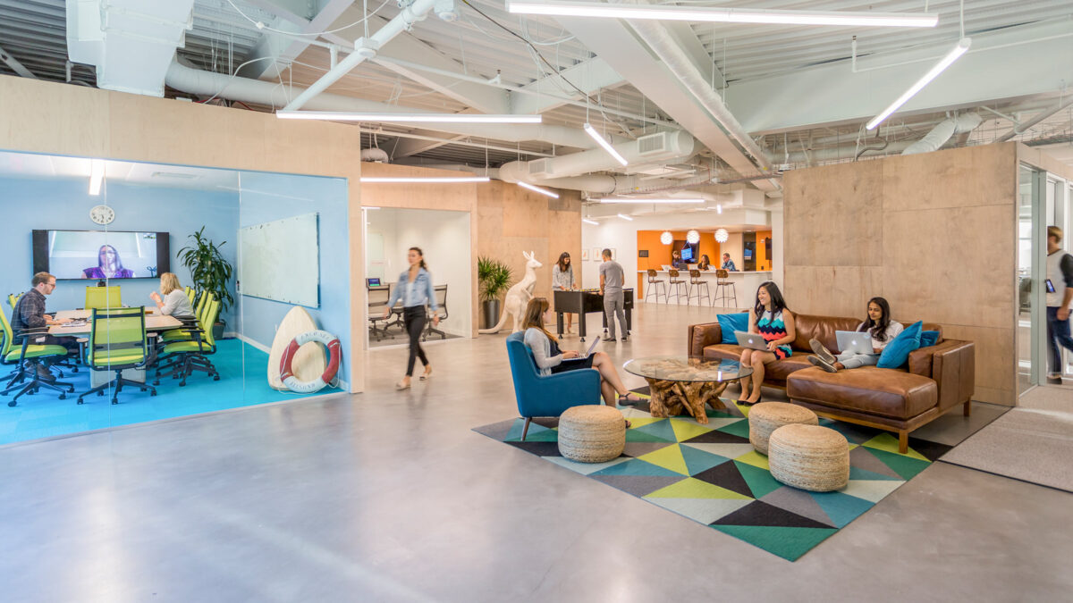 People collaborating in breakout space and meeting rooms