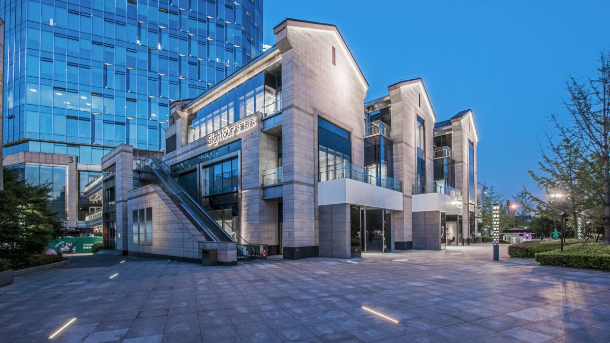 front entrance of Sightour Ophthalmic Hospital building at night