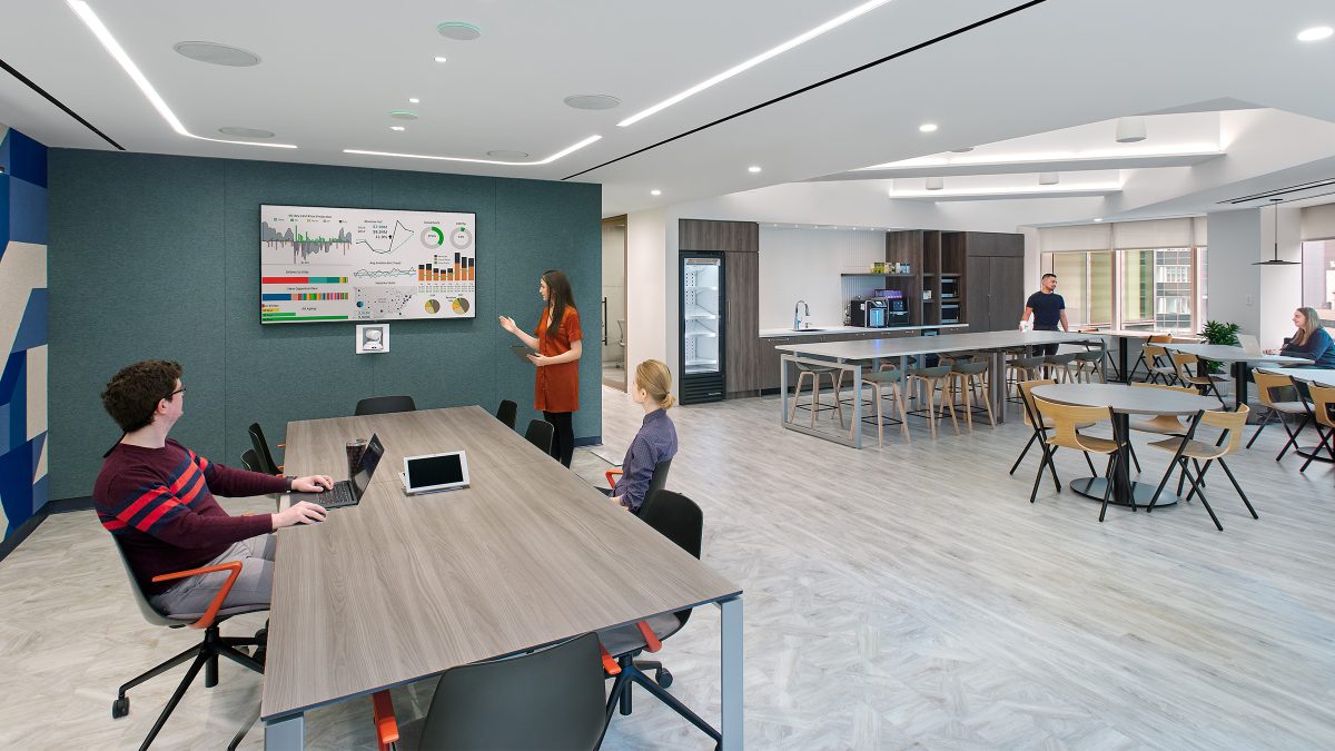 woman giving presentation to colleagues