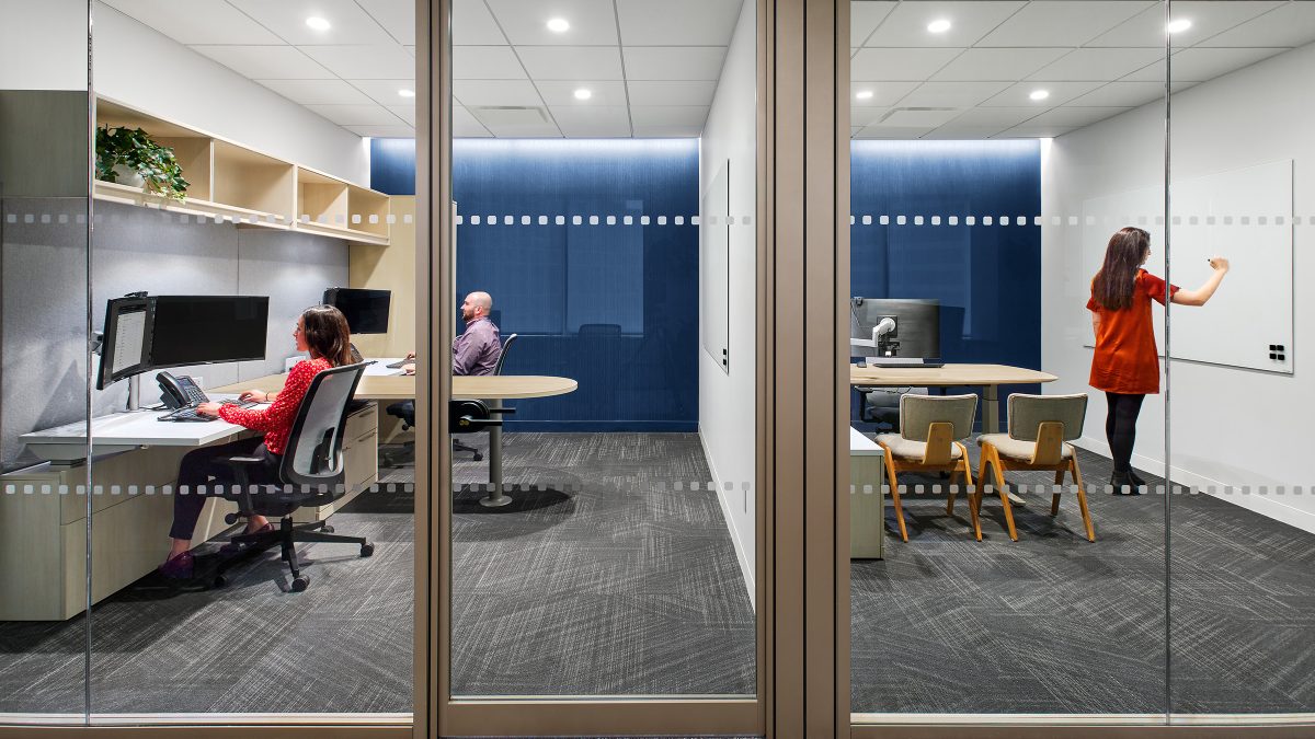 people working in large private office