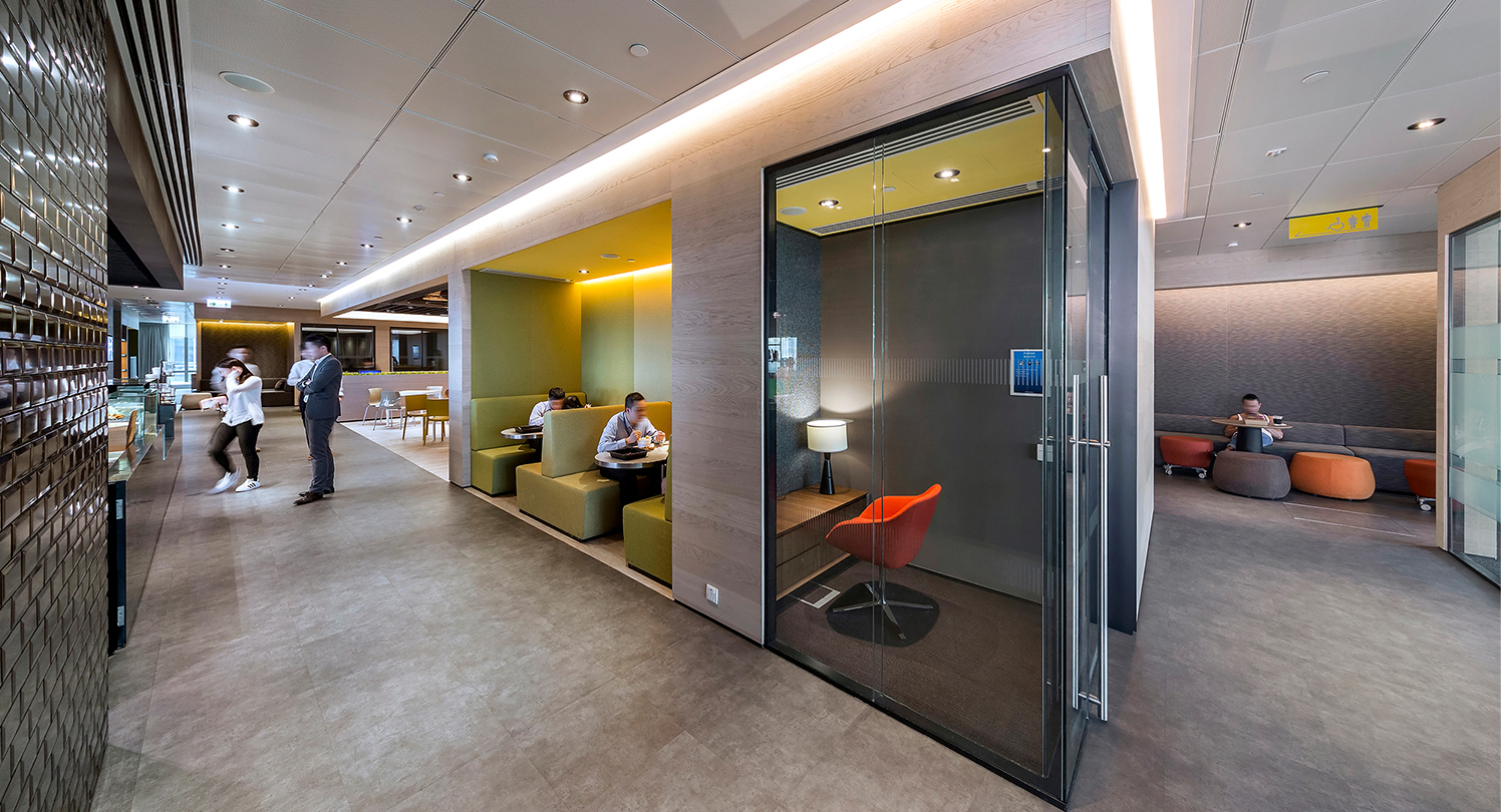 people collaborating in booths and in the kitchen