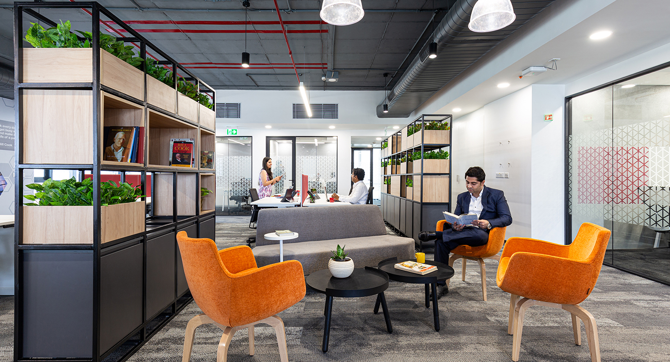 man working in open seated area