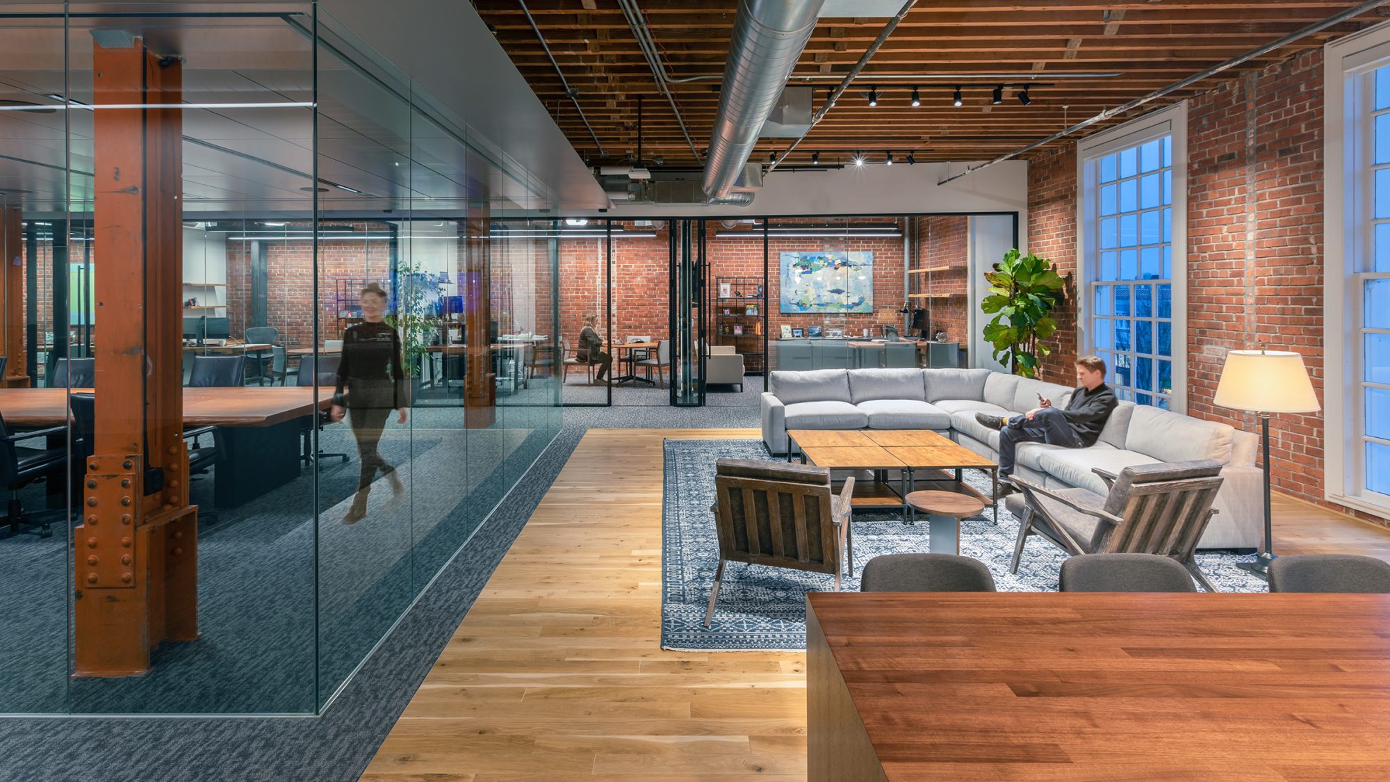 man in lounge and woman walking