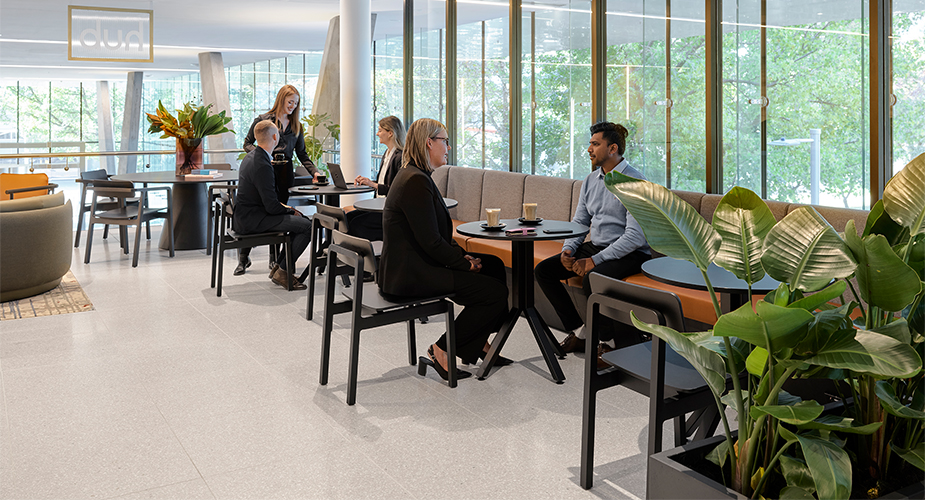 People talking in casual space around reception