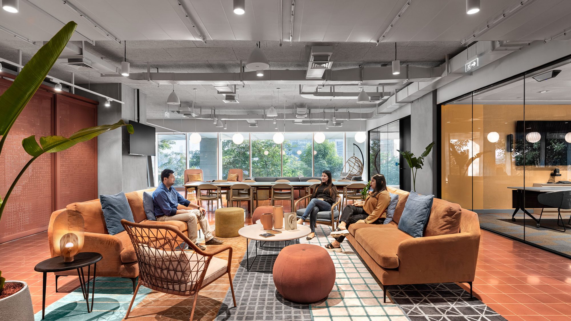 people sitting in colourful workplace lounge